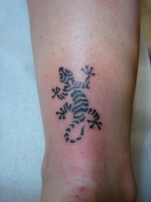 tribal bird tattoo. lizard-tattoo-designs