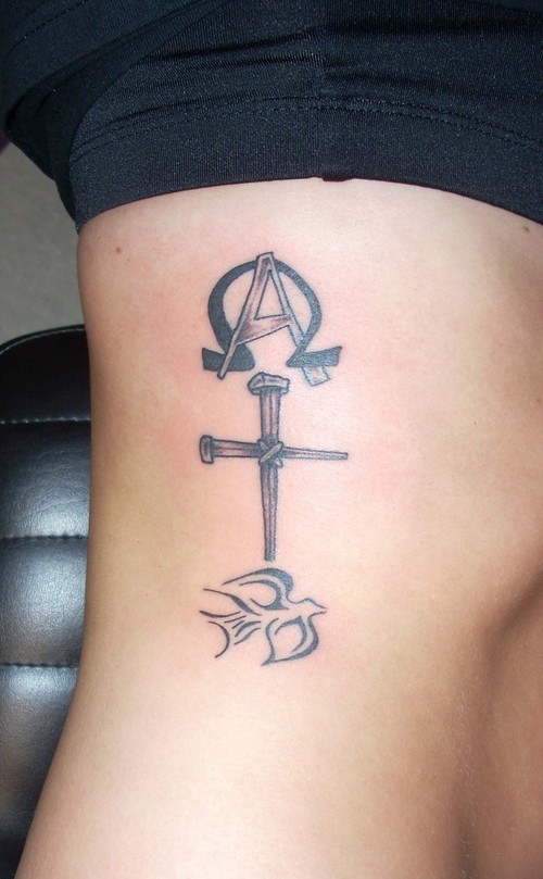 The Holy Cross tattoo is